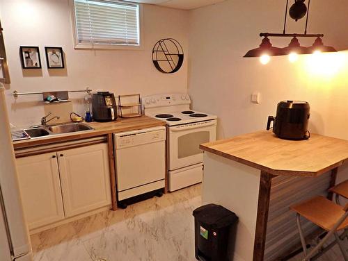 4702 52 Avenue, Vermilion, AB - Indoor Photo Showing Kitchen With Double Sink