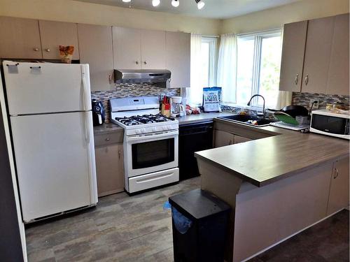 4702 52 Avenue, Vermilion, AB - Indoor Photo Showing Kitchen With Double Sink