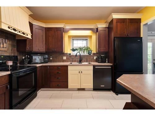 6005 23 Street, Lloydminster, AB - Indoor Photo Showing Kitchen With Double Sink