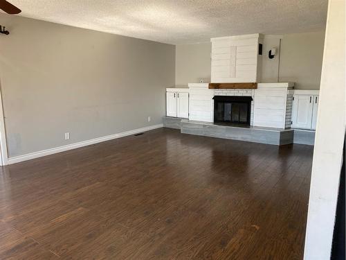 209 Main Street, Waseca, SK - Indoor Photo Showing Other Room With Fireplace