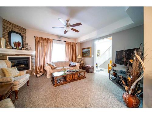 1118 5 Avenue, Wainwright, AB - Indoor Photo Showing Living Room With Fireplace