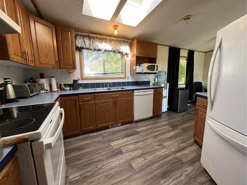 4823 52 Avenue, Irma, AB - Indoor Photo Showing Kitchen With Double Sink