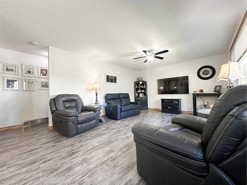 5116 49 Street, Provost, AB - Indoor Photo Showing Living Room With Fireplace