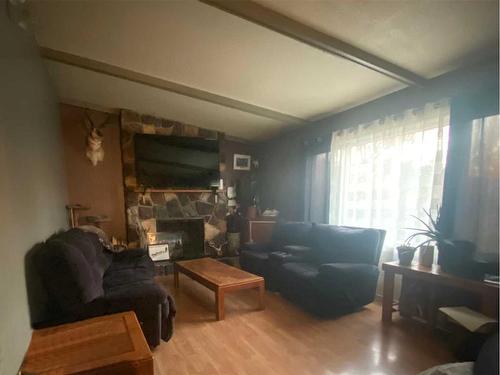 1113 14 Street, Wainwright, AB - Indoor Photo Showing Living Room With Fireplace