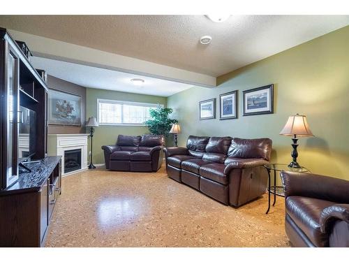 1816 52 Avenue, Lloydminster, AB - Indoor Photo Showing Living Room With Fireplace