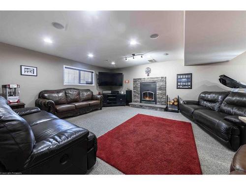 35 Harrier Lane, Rural Vermilion River, County Of, AB - Indoor Photo Showing Other Room With Fireplace