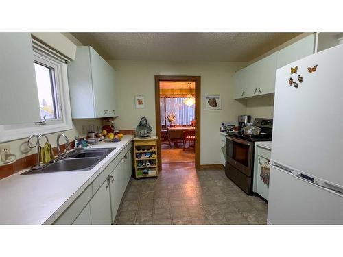 5106 4 Avenue, Chauvin, AB - Indoor Photo Showing Kitchen With Double Sink