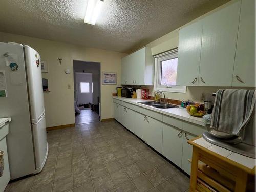 5106 4 Avenue, Chauvin, AB - Indoor Photo Showing Kitchen With Double Sink