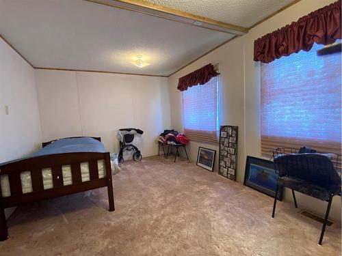 4812 50 Avenue, Mclaughlin, AB - Indoor Photo Showing Bedroom