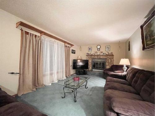 5123 55 Avenue, Edgerton, AB - Indoor Photo Showing Living Room With Fireplace