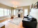 445066 Rng Rd 44, Rural Wainwright No. 61, M.D. Of, AB  - Indoor Photo Showing Living Room With Fireplace 