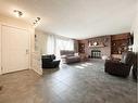 4900 2Nd Avenue North, Chauvin, AB  - Indoor Photo Showing Living Room With Fireplace 