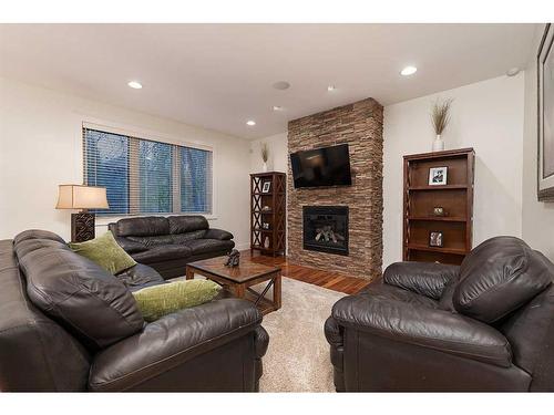 1605 53A Avenue Close, Lloydminster, AB - Indoor Photo Showing Living Room With Fireplace