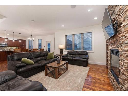 1605 53A Avenue Close, Lloydminster, AB - Indoor Photo Showing Living Room With Fireplace