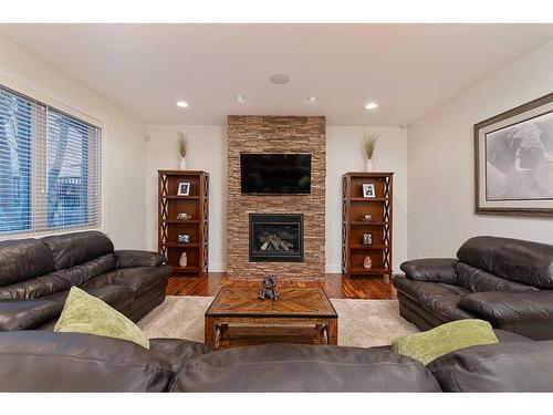 1605 53A Avenue Close, Lloydminster, AB - Indoor Photo Showing Living Room With Fireplace