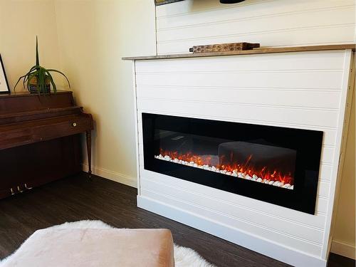 4833 Airport Drive, Vermilion, AB - Indoor Photo Showing Living Room With Fireplace