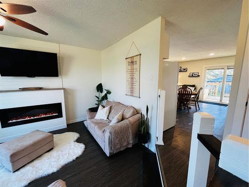 4833 Airport Drive, Vermilion, AB - Indoor Photo Showing Living Room With Fireplace