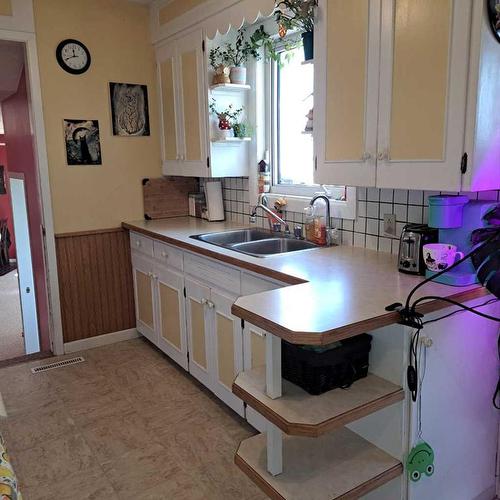 13045 Hwy 16E & King Street, Rural Vermilion River, County Of, AB - Indoor Photo Showing Kitchen With Double Sink