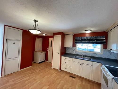 5102 46 Street, Mannville, AB - Indoor Photo Showing Kitchen With Double Sink