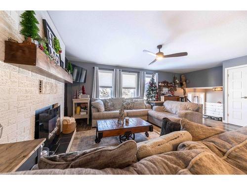 2304 46A Avenue, Lloydminster, SK - Indoor Photo Showing Living Room With Fireplace