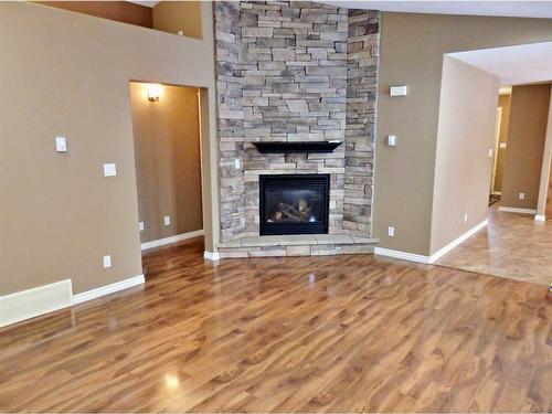 4802 49 Avenue, Vermilion, AB - Indoor Photo Showing Living Room With Fireplace