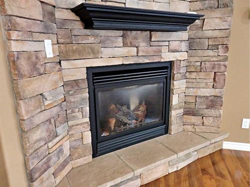 4802 49 Avenue, Vermilion, AB - Indoor Photo Showing Living Room With Fireplace