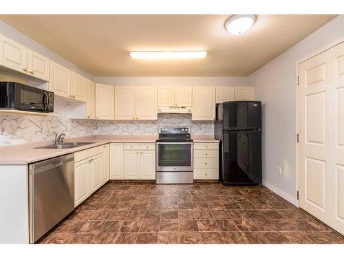 104-5102 47 Street, Lloydminster, AB - Indoor Photo Showing Kitchen With Double Sink