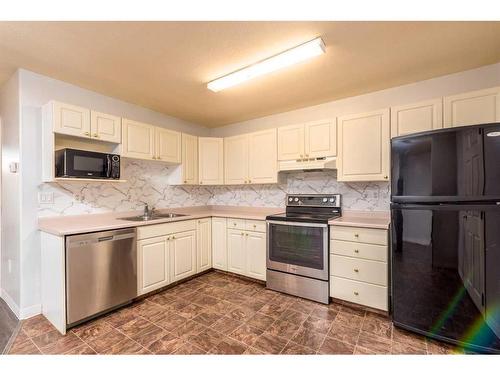 104-5102 47 Street, Lloydminster, AB - Indoor Photo Showing Kitchen With Double Sink