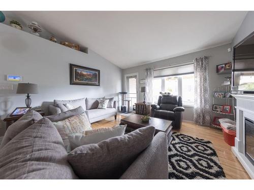 2109 52 Avenue, Lloydminster, AB - Indoor Photo Showing Living Room With Fireplace