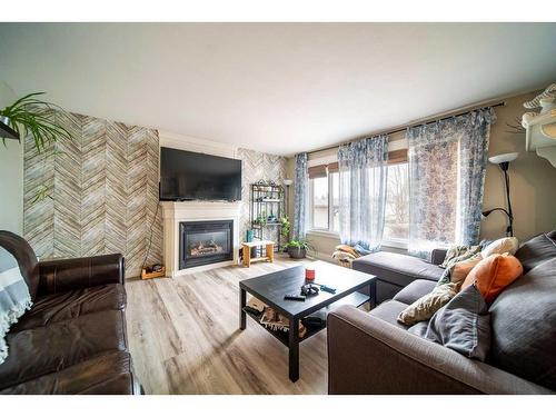 1929 5 Avenue, Wainwright, AB - Indoor Photo Showing Living Room With Fireplace