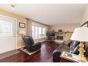 3619 50 Avenue, Lloydminster, SK  - Indoor Photo Showing Living Room With Fireplace 