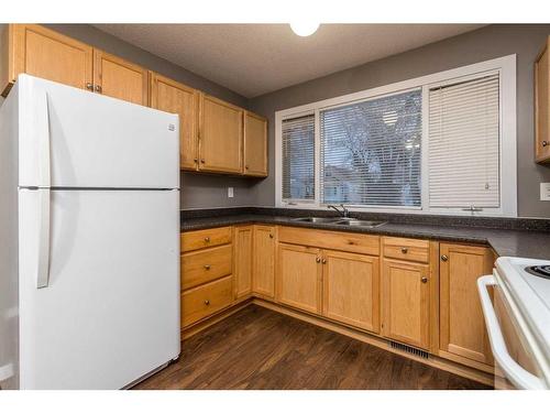 5306 47 Street, Lloydminster, AB - Indoor Photo Showing Kitchen With Double Sink