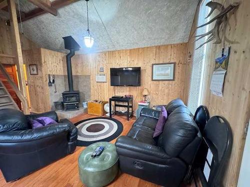 12 Suffern Lake, Suffern Lake, SK - Indoor Photo Showing Living Room With Fireplace