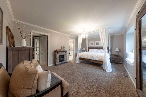 Ne-32-49-25-W3, Rural, SK - Indoor Photo Showing Bedroom With Fireplace