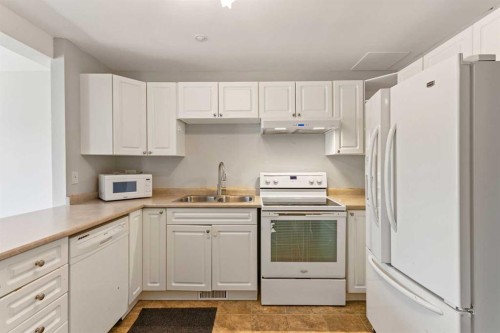 2-19 3 Avenue Se, Marshall, SK - Indoor Photo Showing Kitchen With Double Sink