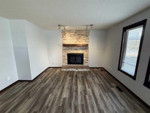 5520 41 Street, Provost, AB - Indoor Photo Showing Living Room With Fireplace