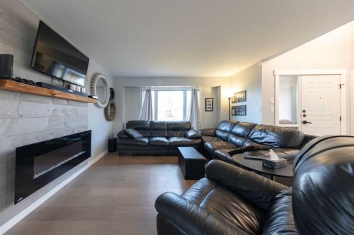 3805 58 Avenue, Lloydminster, AB - Indoor Photo Showing Living Room With Fireplace