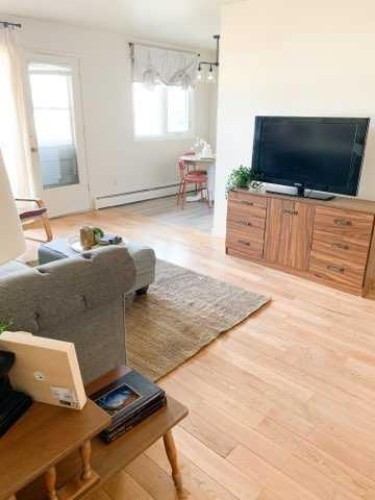 1-8-4504 56A Avenue, Lloydminster, AB - Indoor Photo Showing Living Room