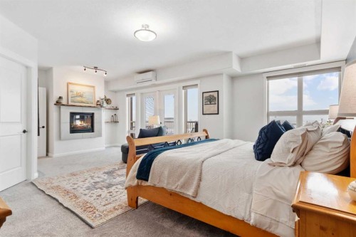 415-4102 69 Avenue, Lloydminster, AB - Indoor Photo Showing Bedroom With Fireplace
