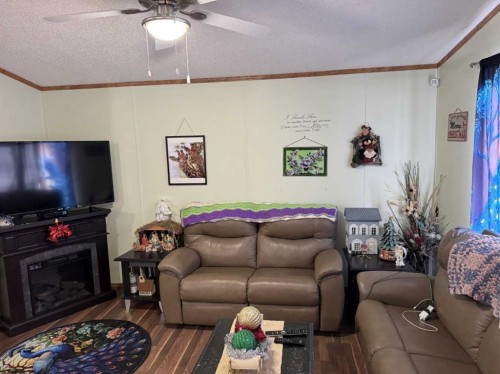 5702 51 Street, Edgerton, AB - Indoor Photo Showing Living Room With Fireplace