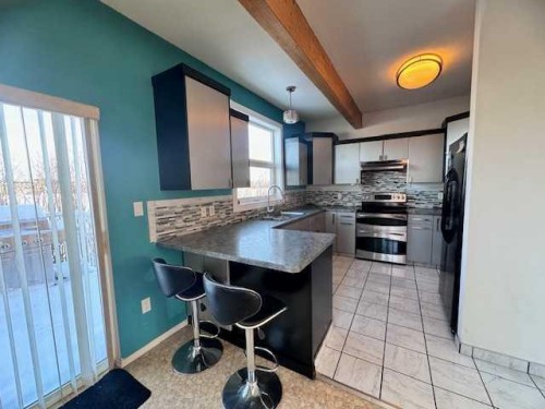 #27 West Bay Estates, Sandy Beach (Sask), SK - Indoor Photo Showing Kitchen