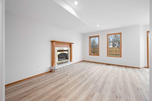 4006 59 Avenue Close, Lloydminster, AB - Indoor Photo Showing Living Room With Fireplace