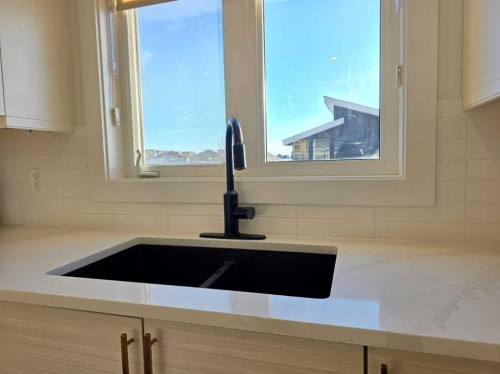 2713 11 Avenue, Wainwright, AB - Indoor Photo Showing Kitchen With Double Sink