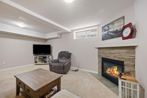 3904 63 Avenue, Lloydminster, AB - Indoor Photo Showing Living Room With Fireplace