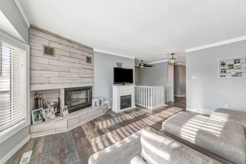 5708 29 Street, Lloydminster, AB - Indoor Photo Showing Living Room With Fireplace