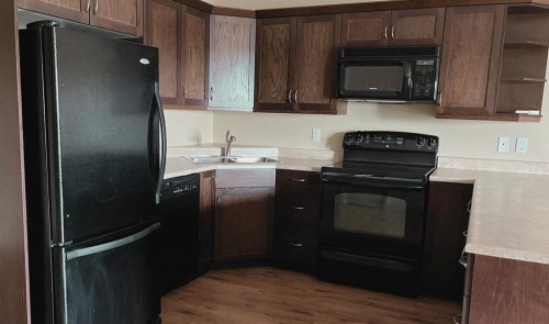 401-2609 11 Avenue, Wainwright, AB - Indoor Photo Showing Kitchen With Double Sink