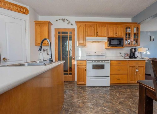 502 5 Avenue, Wainwright, AB - Indoor Photo Showing Kitchen With Double Sink
