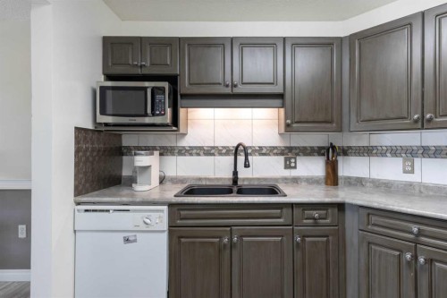 305-5120 49 Street, Lloydminster, AB - Indoor Photo Showing Kitchen With Double Sink