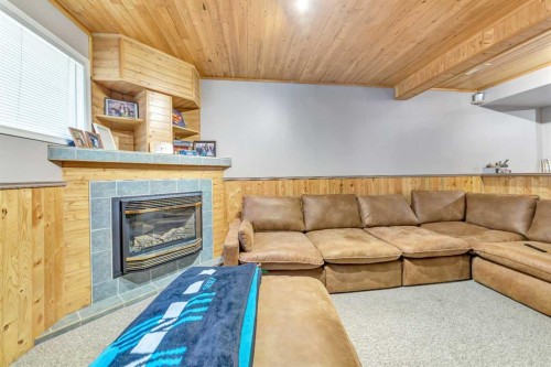 2307 57B Avenue, Lloydminster, AB - Indoor Photo Showing Living Room With Fireplace