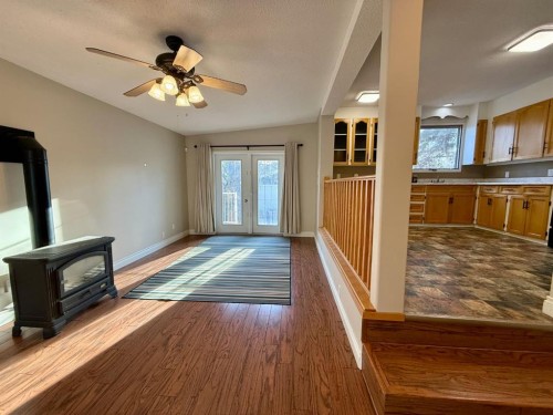 713 6 Avenue, Wainwright, AB - Indoor Photo Showing Other Room With Fireplace